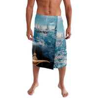 Personalized blue lavalava shorts with ocean and sailboat print, 'YOUR TEXT' front
