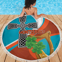 Round beach blanket with white fringe, orange teal cross graphic with green shamrock