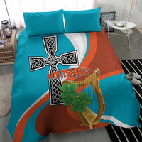 Bedding set with teal and rust duvet cover showing cross and harp design, with two teal pillows