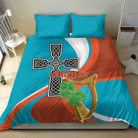 Bedding set with teal and rust duvet cover and two teal pillows, cross and harp graphic