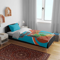 Bedding set with teal and rust duvet cover featuring cross and harp graphic, two teal pillows