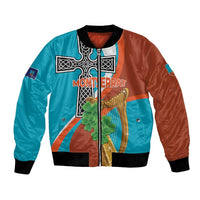 Two-tone bomber jacket with zip front, black ribbed cuffs, and Montserrat graphic on front.