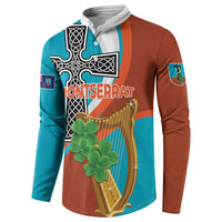 Front view teal and rust button sweatshirt with Montserrat text, harp and clover graphic.