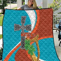 Quilted throw blanket with Montserrat flag design, black cross and harp, green shamrocks