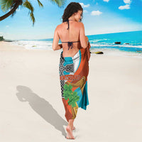 Teal and brown Montserrat sarong with vertical crest and cross harp motif