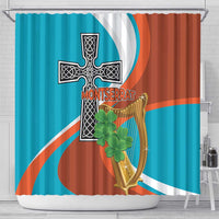 Teal and orange shower curtain with gold harp, black cross, Montserrat lettering, clover