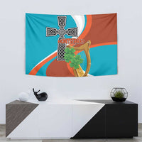 Wall tapestry featuring Montserrat cross, gold harp, and shamrock, teal and orange