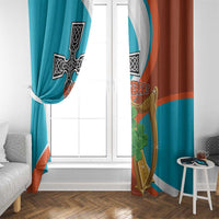 Teal and rust window curtains with black cross, gold harp, and green clover artwork.