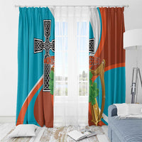 Teal and rust window curtains with gold harp, black cross, and green clover motif.