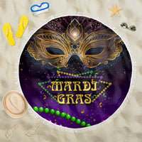 Purple round beach blanket with gold carnival mask graphic, beaded details, white fringe