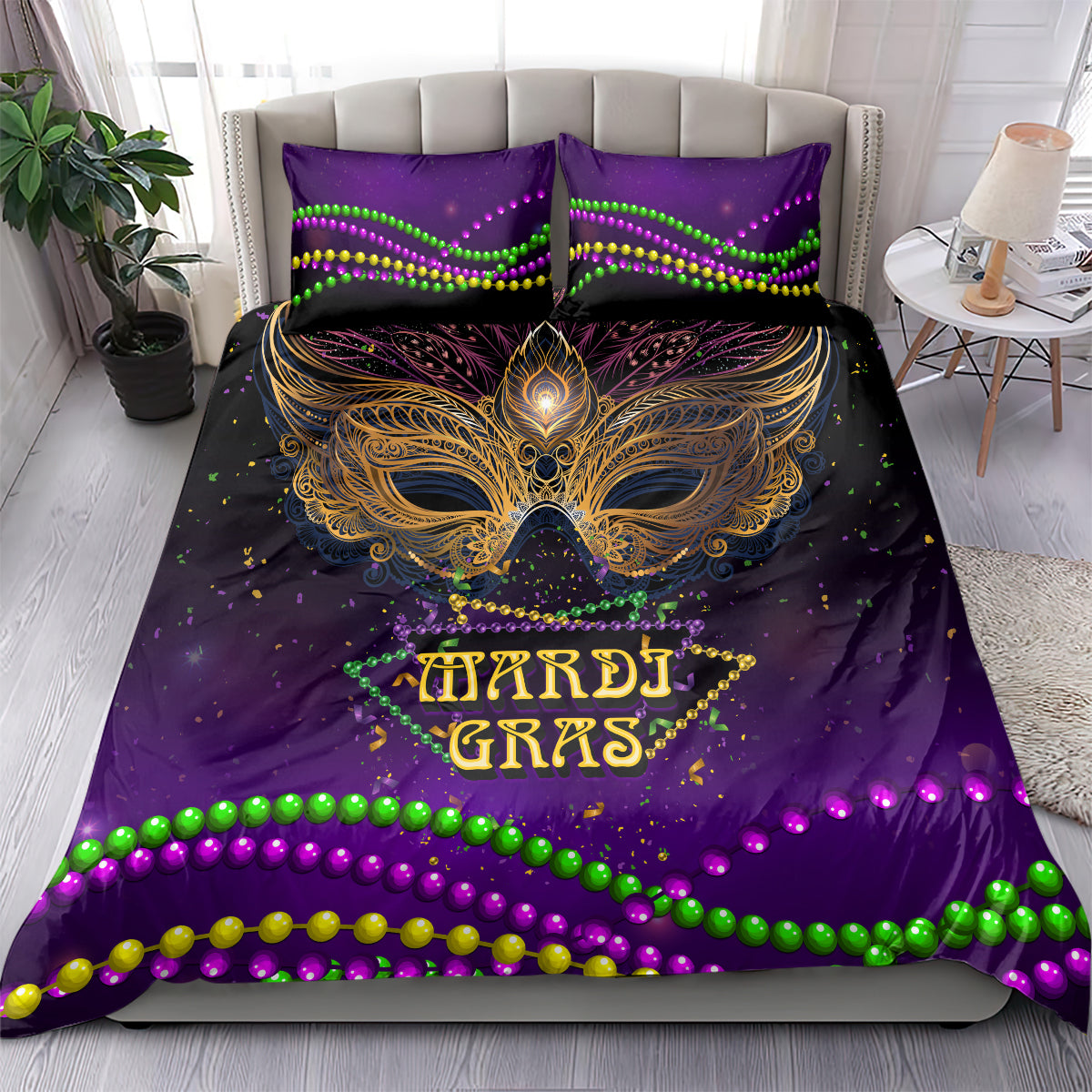Mardi Gras bedding set on bed: purple gold feather mask, multicolor bead border, 2 pillows.