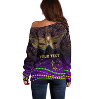 Off-shoulder purple sweater back with gold mask, 'YOUR TEXT', and green bead trim