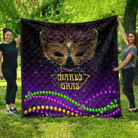 Purple quilt featuring an ornate bird mask center and multicolor Mardi Gras bead trim