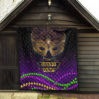 Purple quilt hanging on a porch with gold bird mask and neon bead border stripes