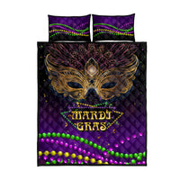 Purple quilt bed set with Mardi Gras mask design, gold lettering, two matching pillowcases