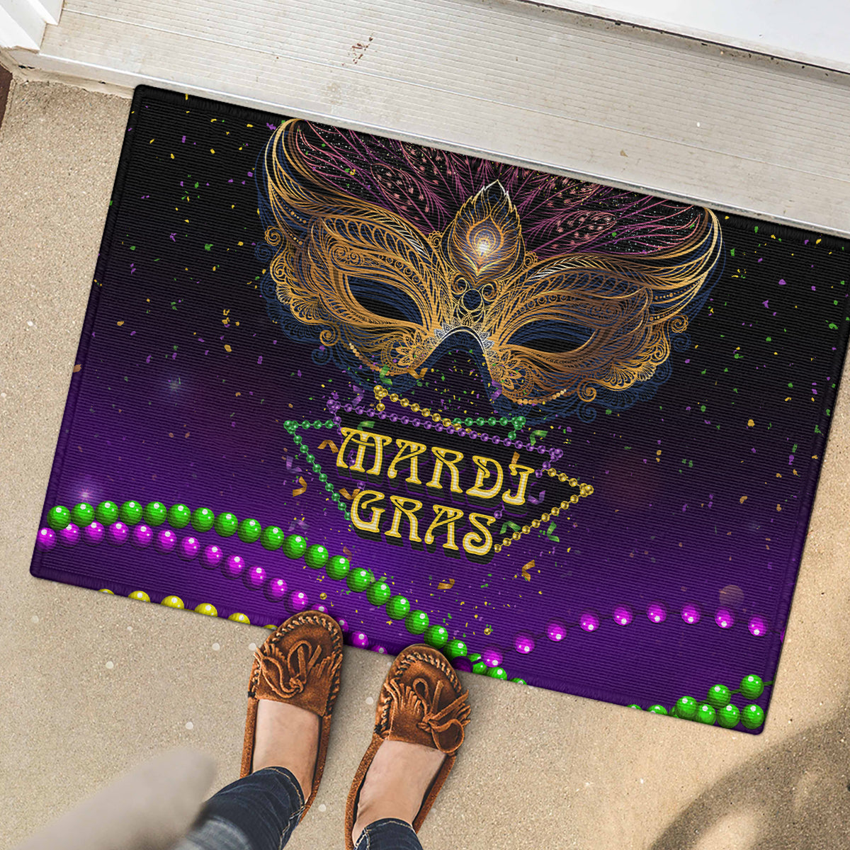 Purple carnival doormat with gold feather mask, HARDI GRAS lettering, green bead and purple dots