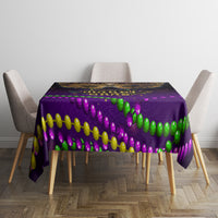 Purple Mardi Gras tablecloth with green and purple beads and colorful party border, centered