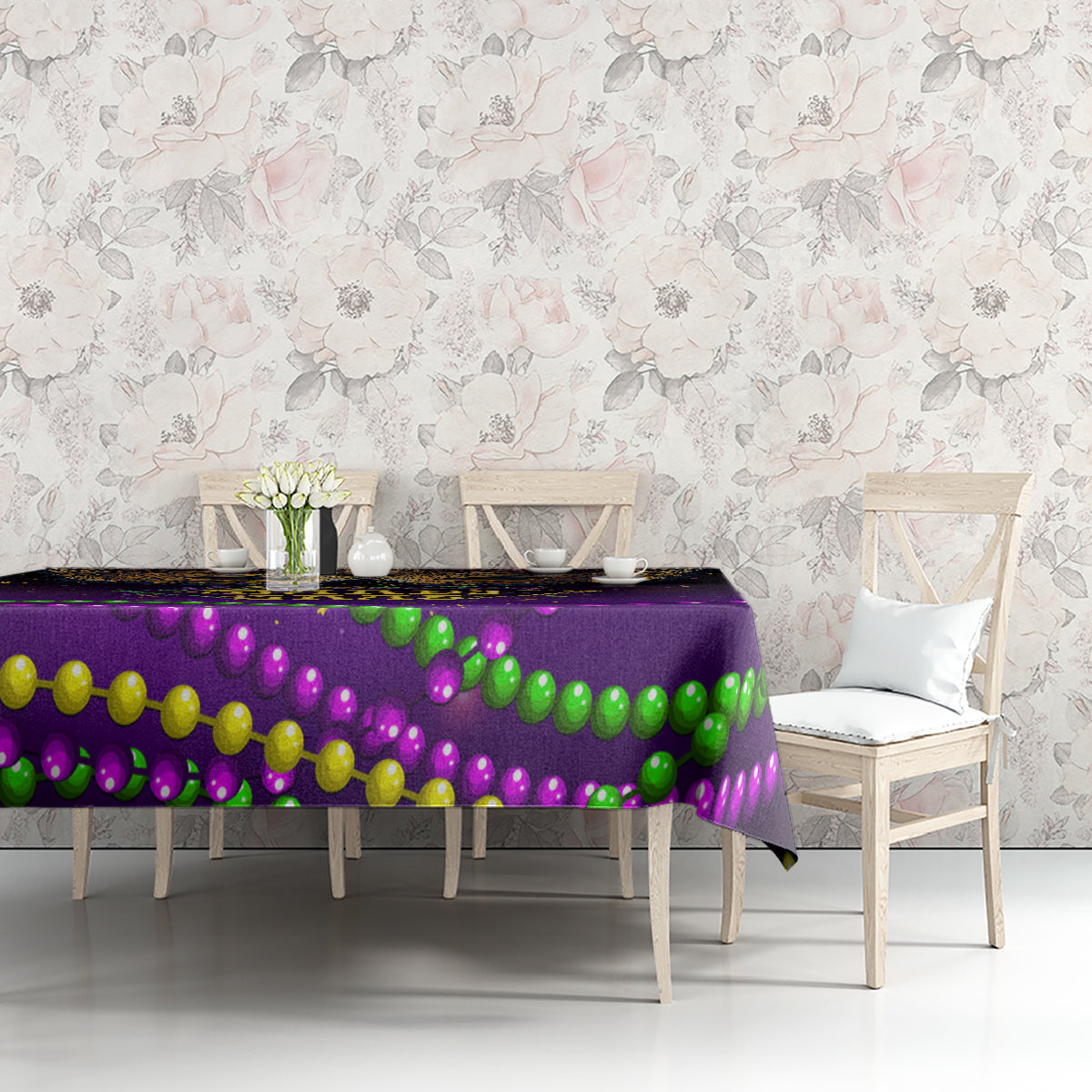 Purple Mardi Gras tablecloth with multicolor bead garland print on long table