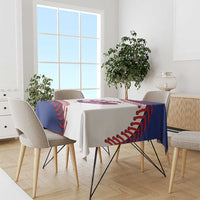 Baseball tablecloth on dining table with blue border and red stitched baseball print