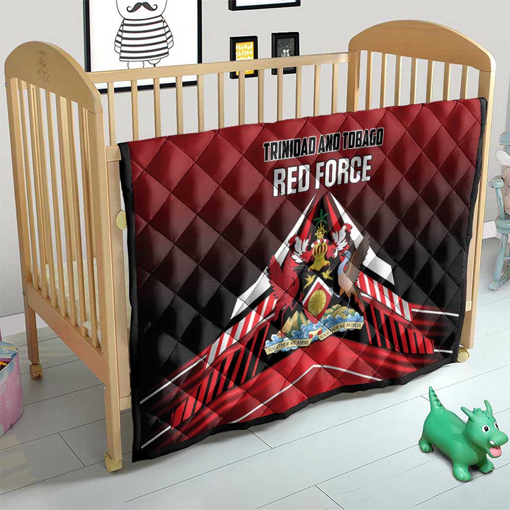 Red and black quilt on baby crib with Trinidad and Tobago Red Force logo