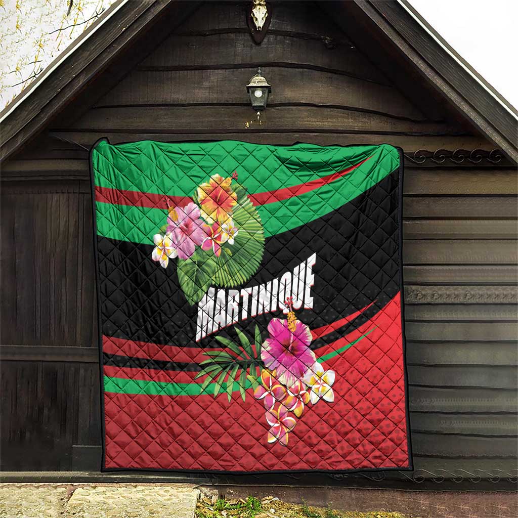 Quilted tropical blanket mat hanging outdoors in green, black, and red with flowers