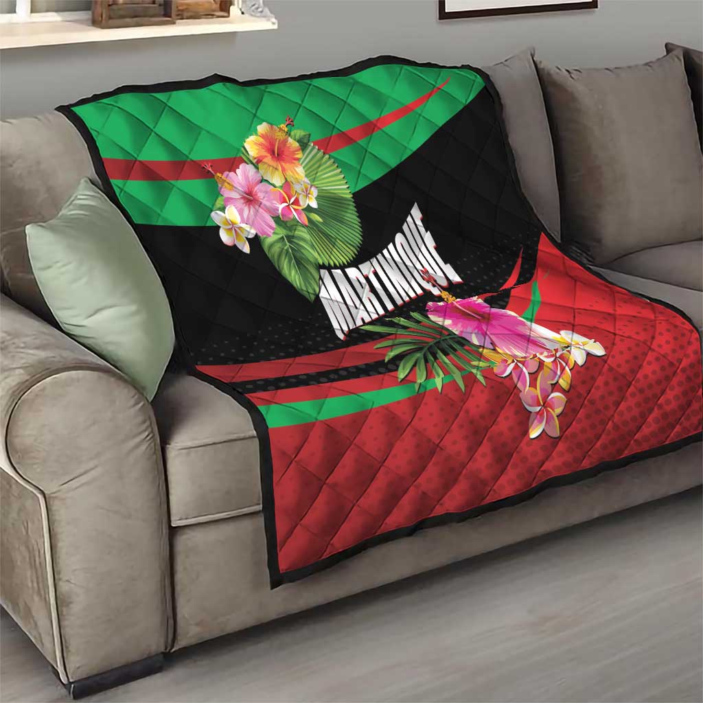 Quilted tropical throw blanket on a sofa with black base, green and red rays, flowers