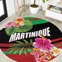 Round black carpet mat with MARTINIQUE text and tropical flowers and leaves