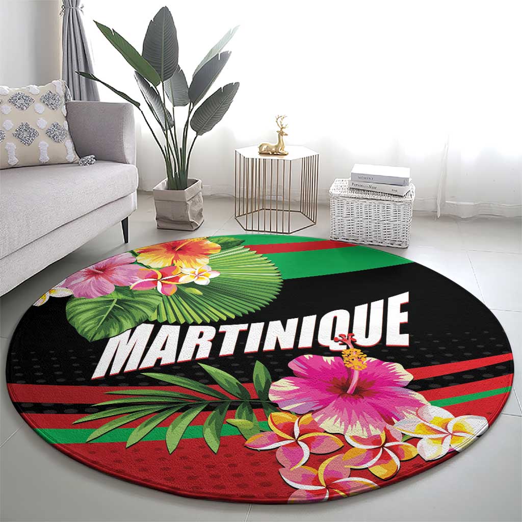 Round black tropical carpet mat with MARTINIQUE text, pink hibiscus, and green leaves