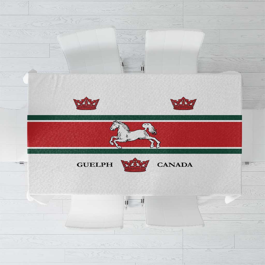 White tablecloth with red-and-green border, crown and horse graphics