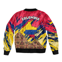 Unisex bomber jacket in red, yellow, and blue with Colombia graphic and tribal hem