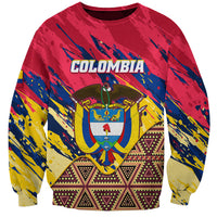 Unisex red crewneck sweatshirt with COLOMBIA graphic and colorful tribal patterns, long sleeves