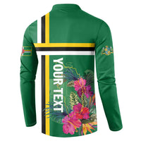 Green button henley sweatshirt, back view with DOMINICA text and tropical flower graphic
