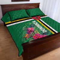 Green quilt bed set with tropical flowers, white-and-yellow stripe, and DOMINICA text