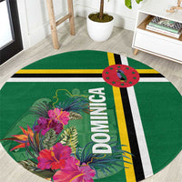 Round green tropical flower rug with vertical “DOMINICA” letters and striped band