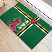 Green rubber doormat with tropical flower bouquet, “DOMINICA” text, and striped center band