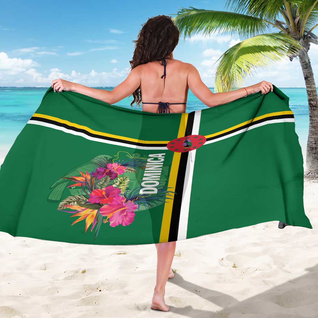Green sarong with vertical emblem stripe, pink tropical flowers, and yellow trim