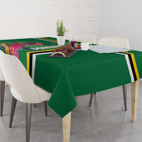 Green tablecloth on dining table with tropical floral stripe band and black trim.