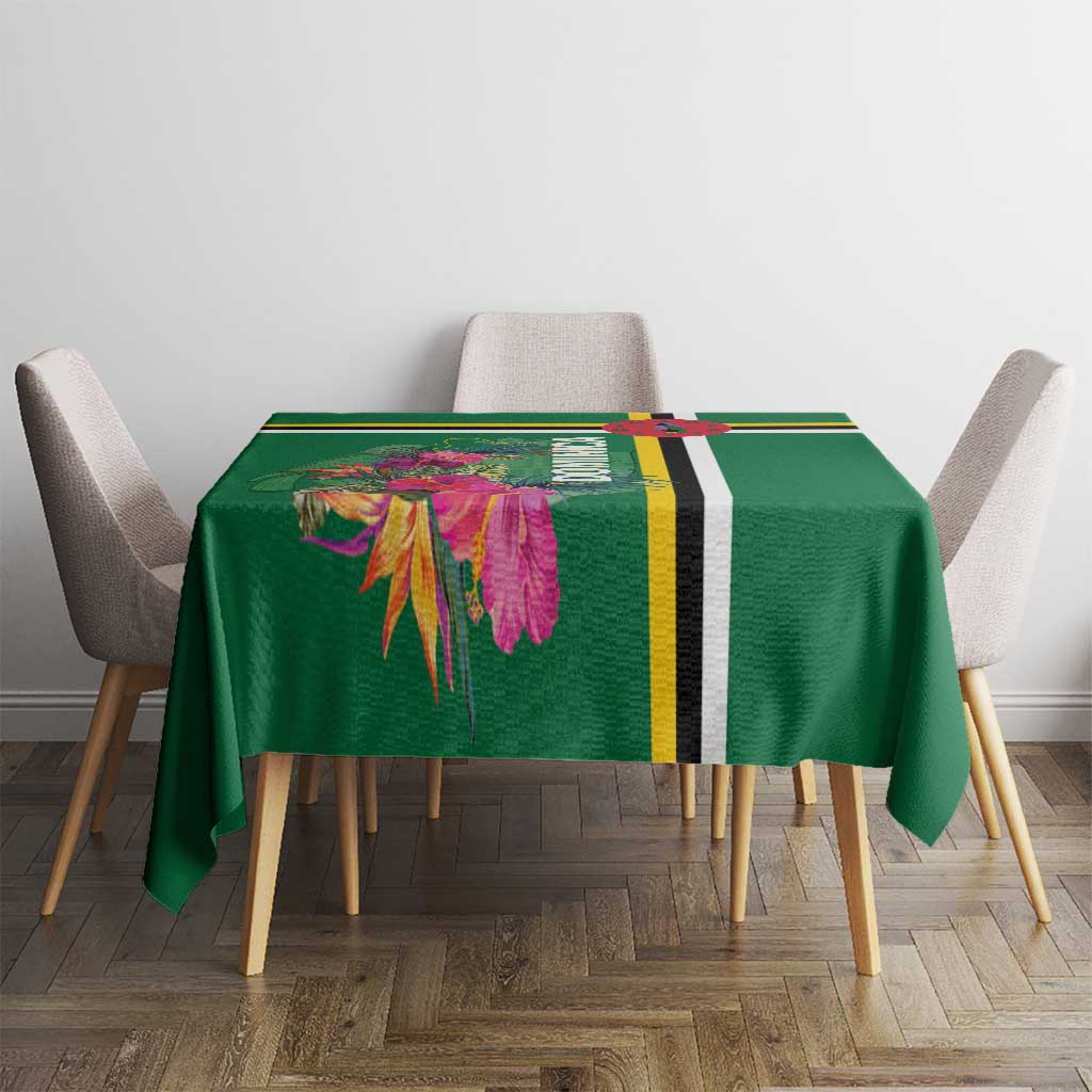 Green tropical floral tablecloth with yellow, black stripe border on small table.