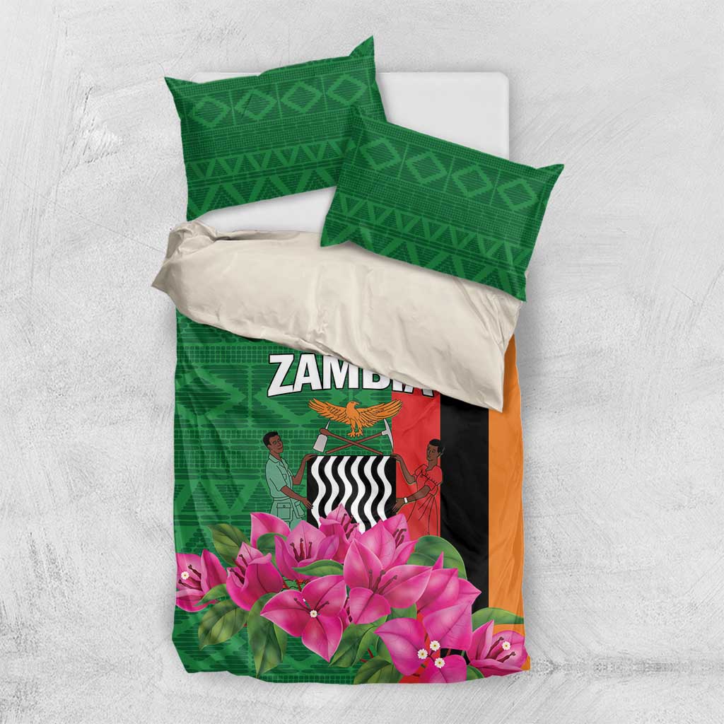 Green bedding set with pink flower print, duvet cover, and two matching pillowcases