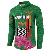 Green button-front sweatshirt, front print with 'ZAMBIA' and pink flowers, Zambia flag accents