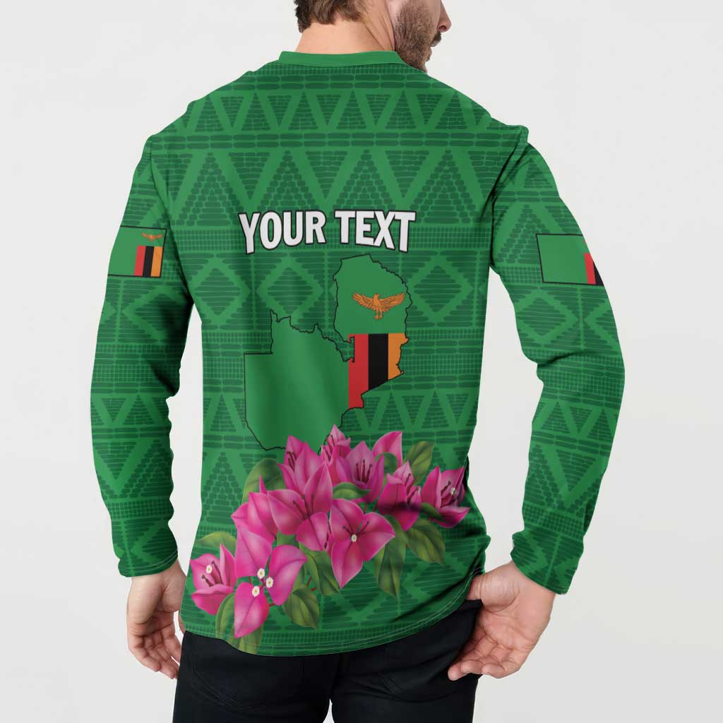 Green button-front sweatshirt, back print with 'YOUR TEXT' and pink blossoms over map graphic