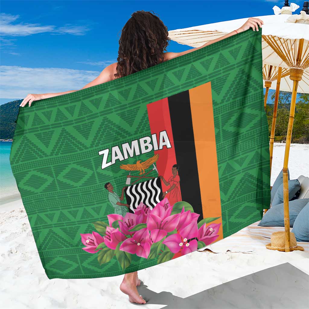 Green Zambia sarong with bold graphic, pink bougainvillea flowers, and decorative border