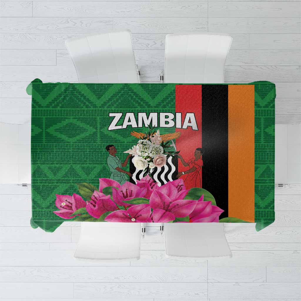Green tablecloth with purple flowers and multicolor vertical geometric blocks