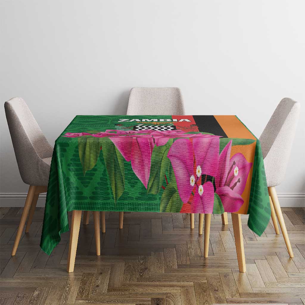 Green tablecloth with purple orchid flowers and multicolor geometric band