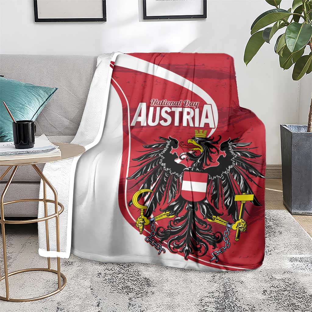Austria National Day blanket on sofa, red-and-white shield with black eagle centerpiece