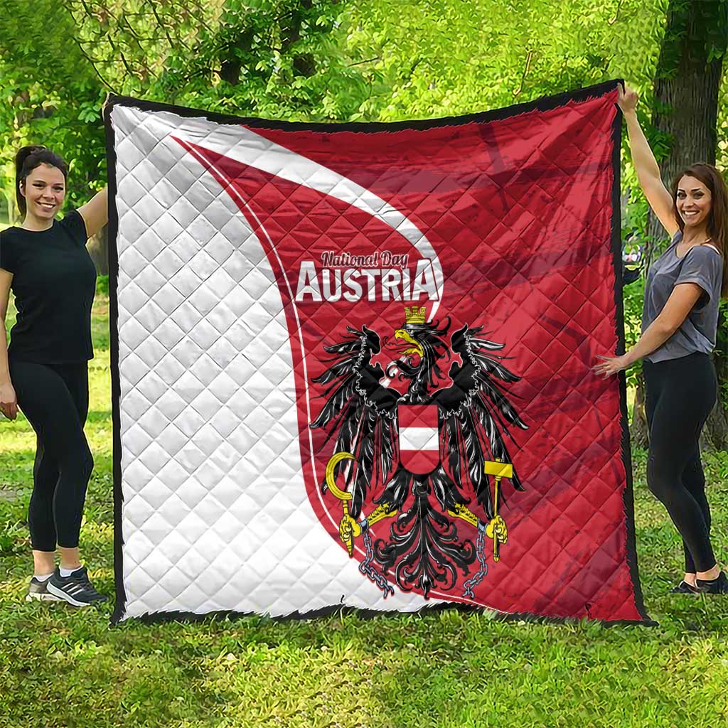 Austria national day quilt spread outdoors: red-and-white diagonals with black eagle crest
