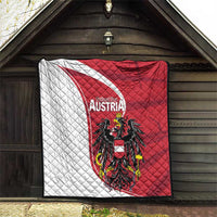 Austria national day quilt hanging under roof, red-and-white diagonals with black eagle