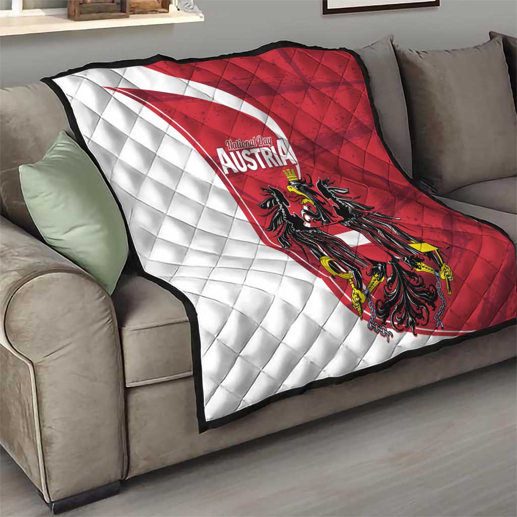 Austria national day quilt on sofa, quilted white and red diagonals with black eagle