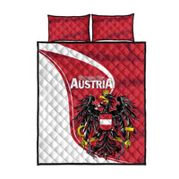 Red quilt bed set with black eagle and Austria text, plus two red quilted pillows