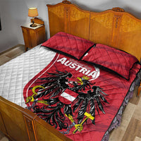 Red and white quilt bed set with black eagle and Austria text; two red pillows